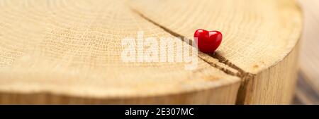 Valentines Day background with hearts. Red heart on old wood. Holidays card with copy space. Stock Photo