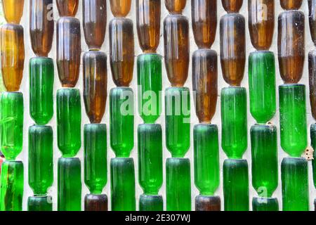 Pattern background from glass  bottles, Background with glass bottles  on the wall Stock Photo