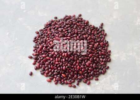 Heap of red beans on a gray stone background Stock Photo