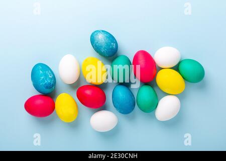 Easter composition. Multicolored easter eggs on blue background. Copy space - Image Stock Photo