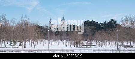 Almudena Cathedral view from Madrid Rio park after Filomena snowstorm. Panoramic photo. January 2021 in Madrid, Spain. Stock Photo