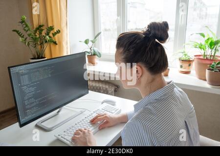 Female programmer working from home, remote, home office. Remote work concept - Image Stock Photo