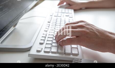 Man hands typing on computer keyboard, business man working on pc in office. Close-up - Image Stock Photo