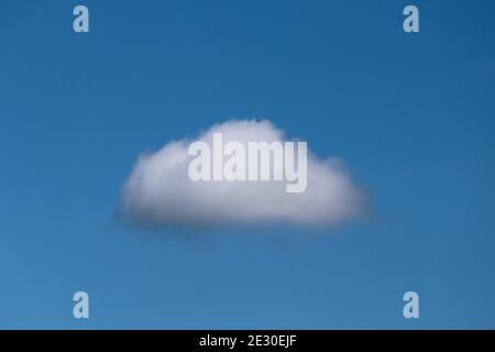 Single nature white cloud on blue sky background in daytime, photo of nature cloud for freedom and nature concept. Stock Photo