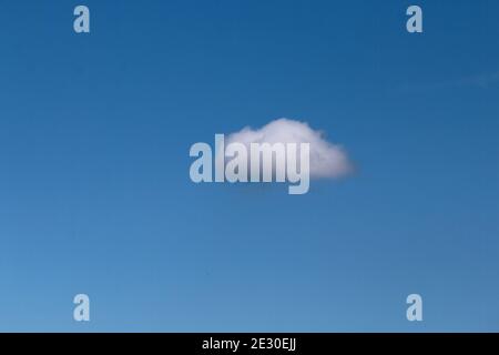 Single nature white cloud on blue sky background in daytime, photo of nature cloud for freedom and nature concept. Stock Photo