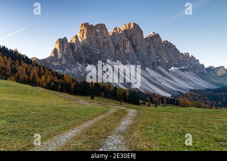 View of a sunrise in front of the Odle massif from the Gampen Malga . Funes Valley, Dolomites Alps, Trentino Alto Adige, Italy. Stock Photo