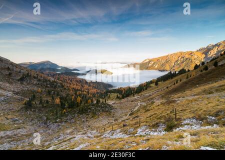 View of the Odle mountains during a foggy morning. Funes Valley, Dolomites Alps, Trentino Alto Adige, Italy. Stock Photo