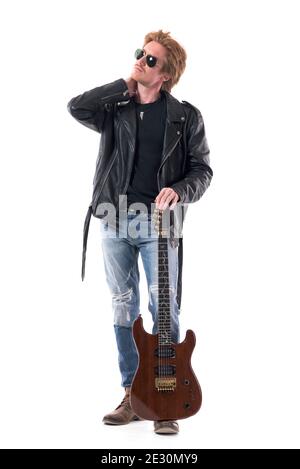 Macho fashionable young redhead rock musician posing with guitar with hand on neck. Full body isolated on white background. Stock Photo