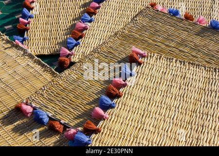 wicker tablecloths with colored tassels Stock Photo