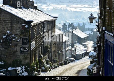 Haworth Main street  under snow in Winter, Bronte Country, West Yorkshire Stock Photo