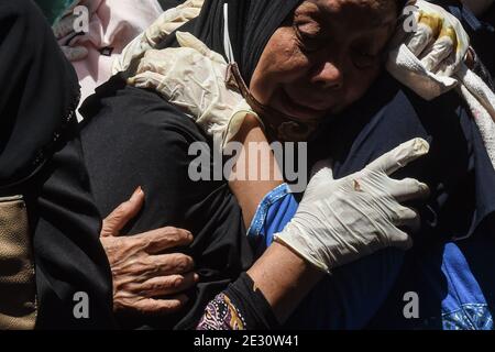 West Java, Indonesia. 16th Jan, 2021. A relative weeps during a funeral held for victim of the Sriwijaya Air flight SJ-182 crash in Depok, West Java, Indonesia, Jan. 16, 2021. The Sriwijaya Air plane plunged into the sea off Kepulauan Seribu (Seribu Islands) after taking off from Jakarta, Indonesia on a domestic flight with 62 people on board on Jan. 9. Credit: Agung Kuncahya B./Xinhua/Alamy Live News Stock Photo
