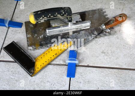Tile levelling system with plastic clips, wedges and equipment. Stock Photo