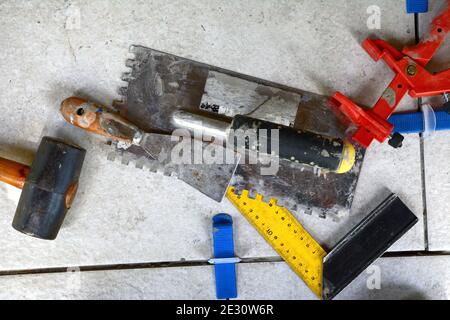 Tile levelling system with plastic clips, wedges and equipment. Stock Photo