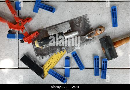 Tile levelling system with plastic clips, wedges and equipment. Stock Photo