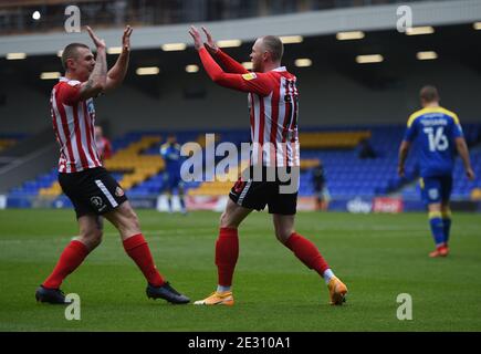 London, UK. 16th Jan, 2021. Sunderland's Aiden O'Brien celebrates as his cross in turned into the net by Charlie Wyke (not pictured) for their first goal with team mate Max Power during the Sky Bet League 1 match at Plough Lane, London Picture by Daniel Hambury/Focus Images/Sipa USA 16/01/2021 Credit: Sipa USA/Alamy Live News Stock Photo