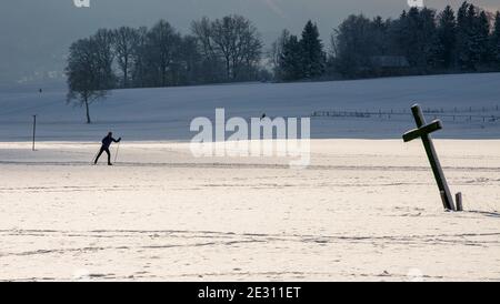 Ettal, Germany. 16th Jan, 2021. A cross-country skier makes his way through the snowy area. Credit: Peter Kneffel/dpa/Alamy Live News Stock Photo
