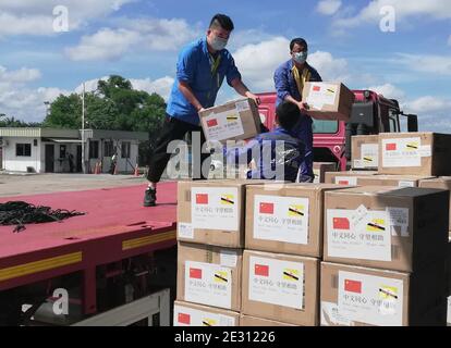 (210116) -- BEIJING, Jan. 16, 2021 (Xinhua) -- People unload medical materials donated by China in Bandar Seri Begawan, Brunei, April 23, 2020. TO GO WITH XINHUA HEADLINES OF JAN. 16, 2021 (Photo by Jeffrey Wong/Xinhua) Stock Photo