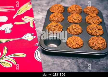 Vegetarian muffins in cooking tray with red napkin Stock Photo