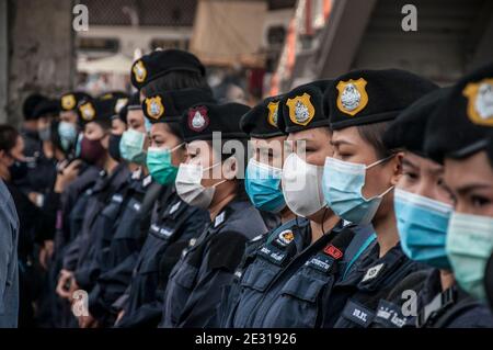 Riot women police stand on guard during the demonstration. At least two protesters were arrested by the police for violating the emergency decree as they attended a demonstration for writing messages against the government on a long banner that is 112 meters long at Victory Monument. More than 30 of the protesters and anti-government leaders, who took part in the pro-democracy protests, are facing the lese majeste charges under article 112 of the Thai criminal code, and one of them is 16 years old. The protesters are calling for the political and monarchy reforms and the resignation of the pri Stock Photo