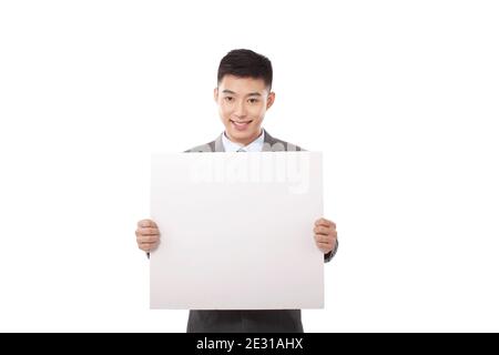Portrait of young bisiness man holding whiteboard high quality photo Stock Photo