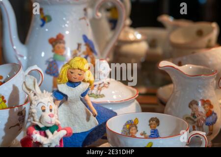 Vintage 1950s fairytale figures among a child's tea set. Stock Photo