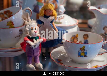 Vintage 1950s fairytale figures among a child's tea set. Stock Photo