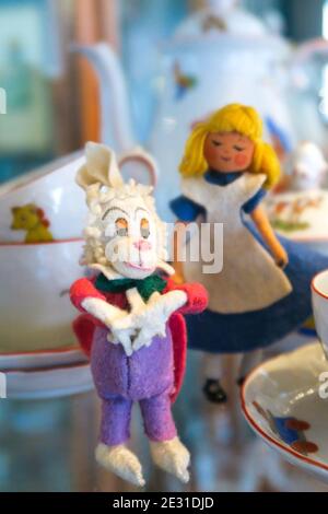 Vintage 1950s fairytale figures among a child's tea set. Stock Photo