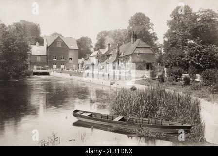 Vintage 19th century photograph: Whitchurch Mill and cottages. Whitchurch is a market town in northern Shropshire, England. It lies 2 miles east of the Welsh border, 2 miles south of the Cheshire border. Stock Photo