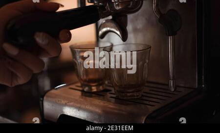 espresso shot from coffee machine make by barista in coffee shop cafe Stock Photo
