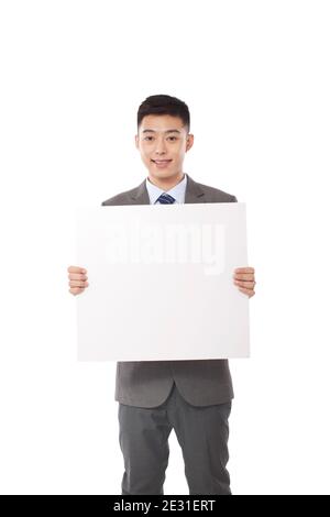 Portrait of young bisiness man holding whiteboard high quality photo Stock Photo