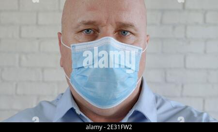 Engineer Portrait Wearing Protective Eyeglasses, and Medical Face Mask in Coronavirus Pandemic Stock Photo