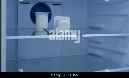 Fresh Yogurt in an Empty Fridge in the Kitchen Stock Photo