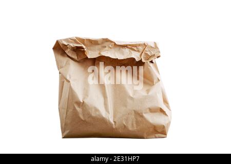 Closeup wrapped and crumpled brown paper bag isolated on white Stock Photo