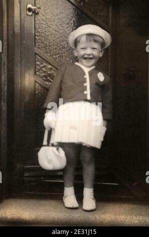 Young girl in her Whit Sunday best clothes, Lancashire, UK, in the 1960's Stock Photo