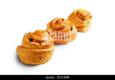 Three buns with raisin isolated on white. Angle view. Clipping path. Shadow. Stock Photo