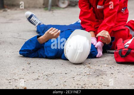 First aid after work accident Stock Photo