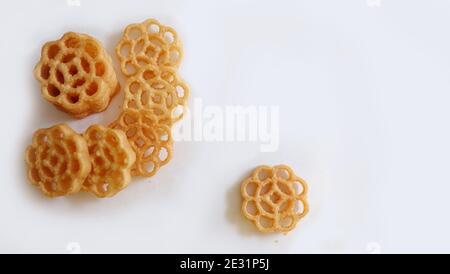 Flat lay of honeycomb cookies, also known as kuih loyang in Malaysia, is a popular deep-fried sweet snack during festivals. Stock Photo
