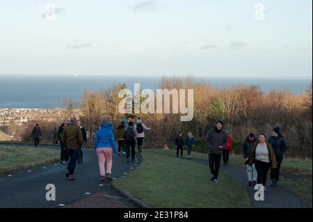 Edinburgh, Scotland, UK. 16th of January 2021: Coronavirus Daily Exercise. The roads and pathways in Holyrood Park were busy with people taking their daily exercise. For those up for the climb, the very top of Arthur's Seat gave some great views across Scotland’s capital city.Credit: Alamy Live News Stock Photo