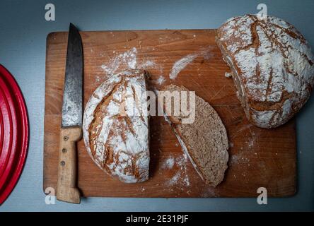 homemade wholemeal bread in a dutch oven ,cast iron pan.baking at home . Stock Photo