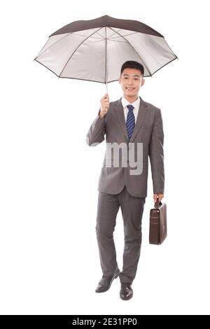 Portrait of young bisiness man holding umbrell high quality photo Stock Photo