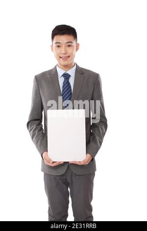 Portrait of young bisiness man holding whiteboard high quality photo Stock Photo
