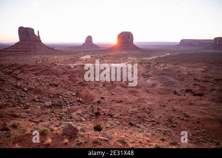 The famous West Mitten, East Mitten and Merrick Butte rock formations at sunrise in Monument Valley Navajo Tribal Park, Arizona and Utah, USA Stock Photo