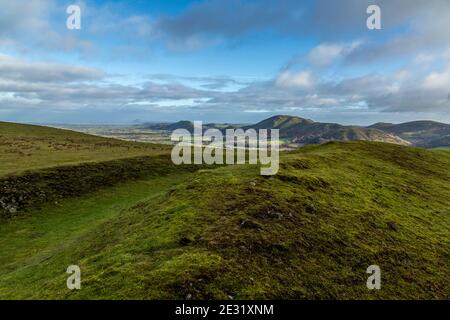 View from Bodbury Ring Hill Fort on the Long Mynd, Shropshire, England, with Caer Caradoc, The Lawley, with The Wrekin in the distance. Stock Photo