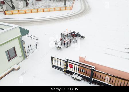 utility tractor pulled out to clear snow from roads top view. Stock Photo