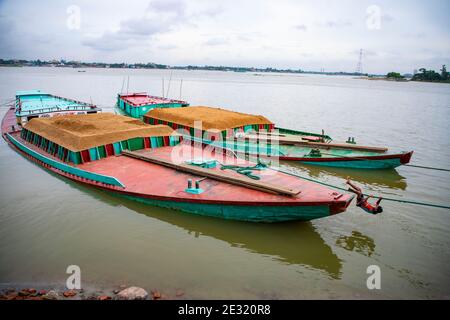 Bulkhead ships loaded with sand anchored on the bank of Meghna River  at Ashuganj, Brahmanbaria, Bangladesh. Stock Photo