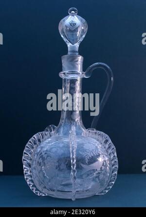 Victorian copy of a 1680's Dutch Venise pinched trailed shaft and globe decanter, with diamond point engraving of birds and foliage  Bohemian Stock Photo