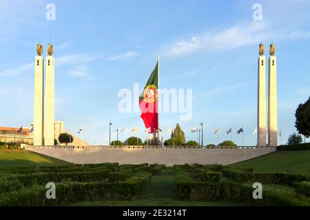 April 25th monument in the Eduardo VII Park with the Portuguese flag flying in the middle. Lisbon, Portugal. Stock Photo