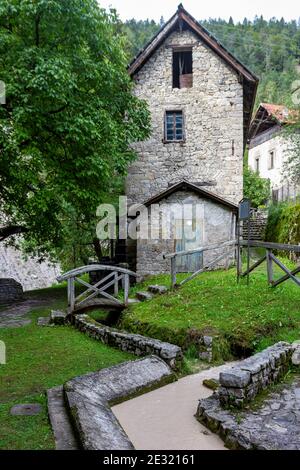 Ancient watermill in the Dolomites mountains Stock Photo