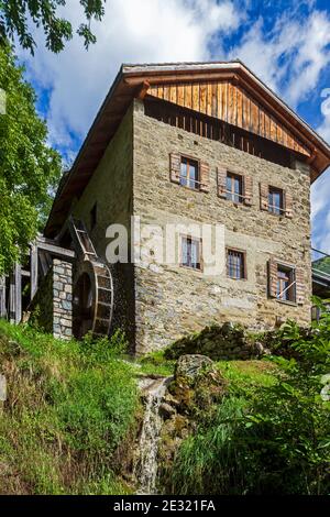 Ancient watermill in the Dolomites mountains Stock Photo