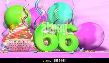 Birthday cupcake with sparking candle with the number 66 large in green with cupcakes with red cream decorated with chocolate chips and balloons on th Stock Photo